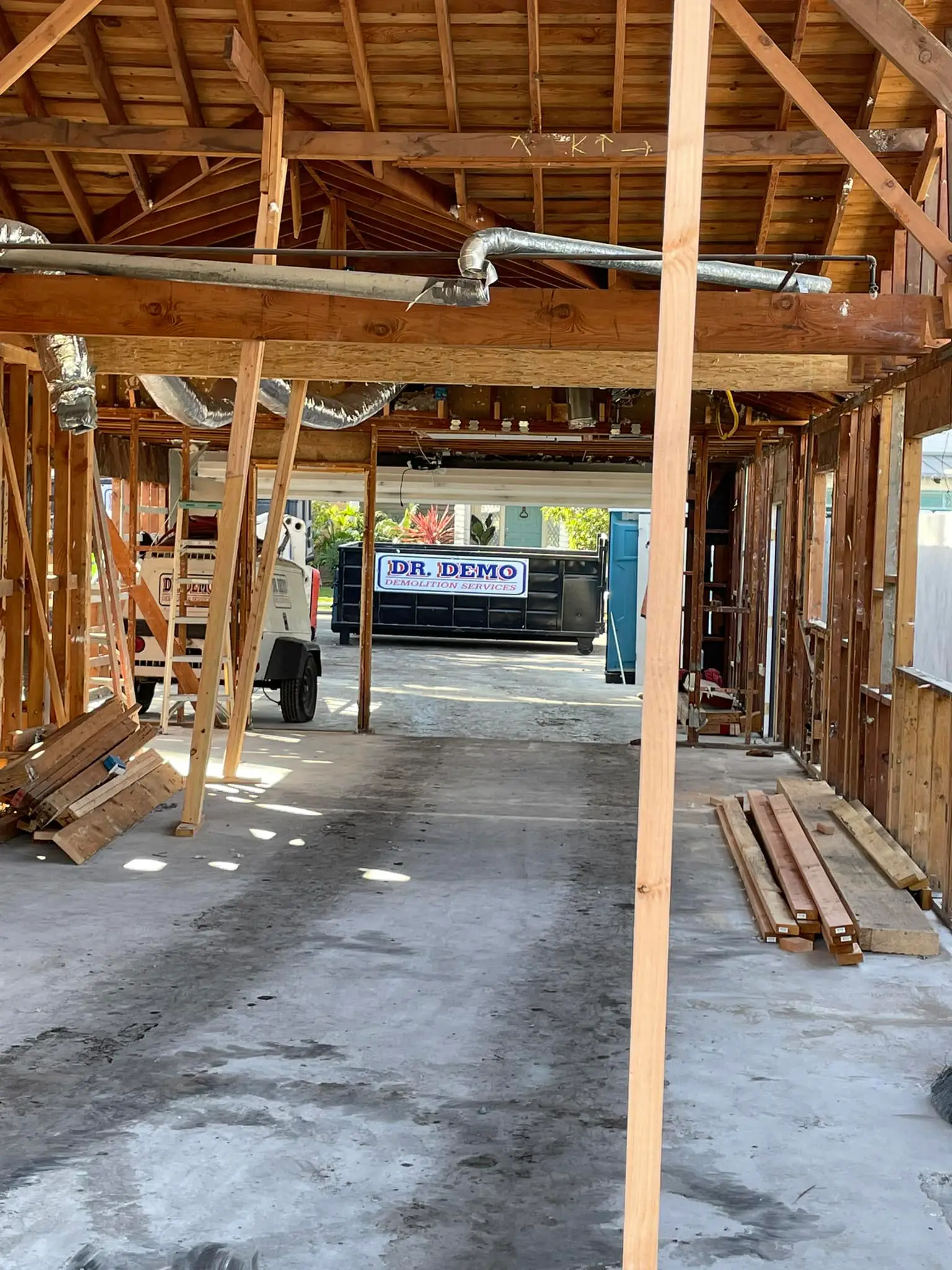 Dr Demo dumpster used for landscaping and yard waste removal in La Mesa